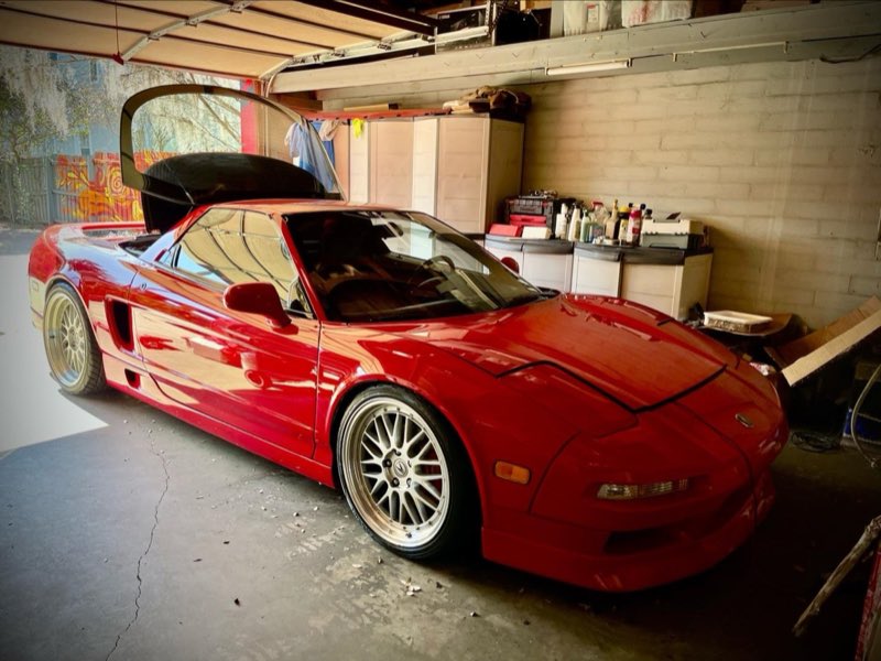 A client's red Acura NSX in the shop